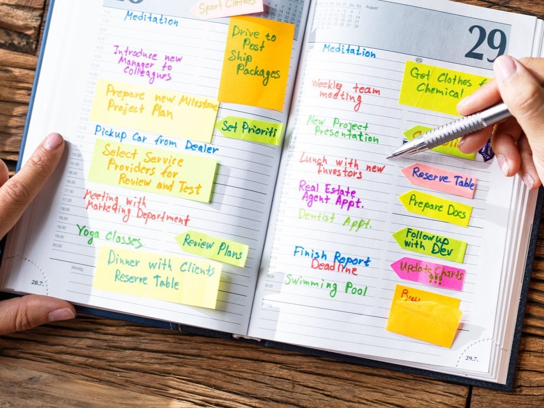 Image of planner book filled out with tasks.
